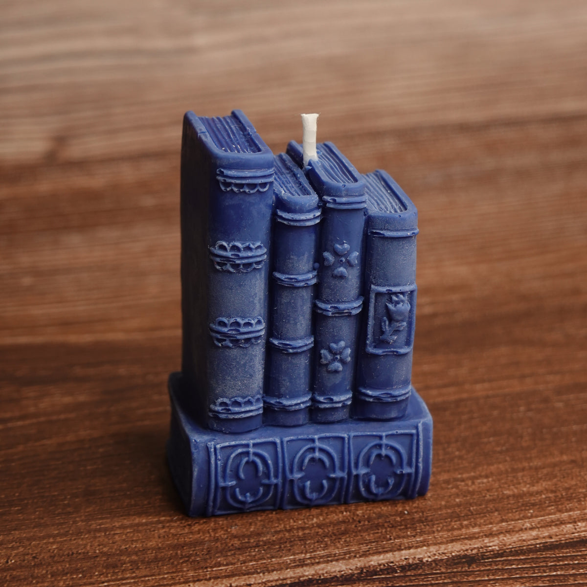 Book stack pillar candle turquoise purple