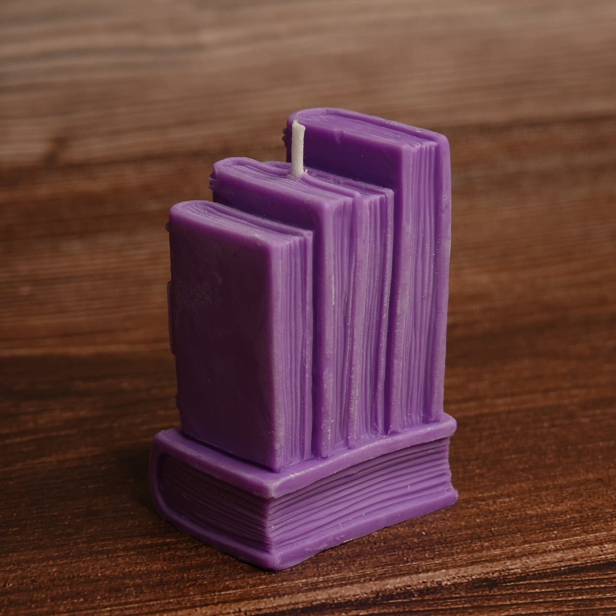 Book stack pillar candle turquoise purple