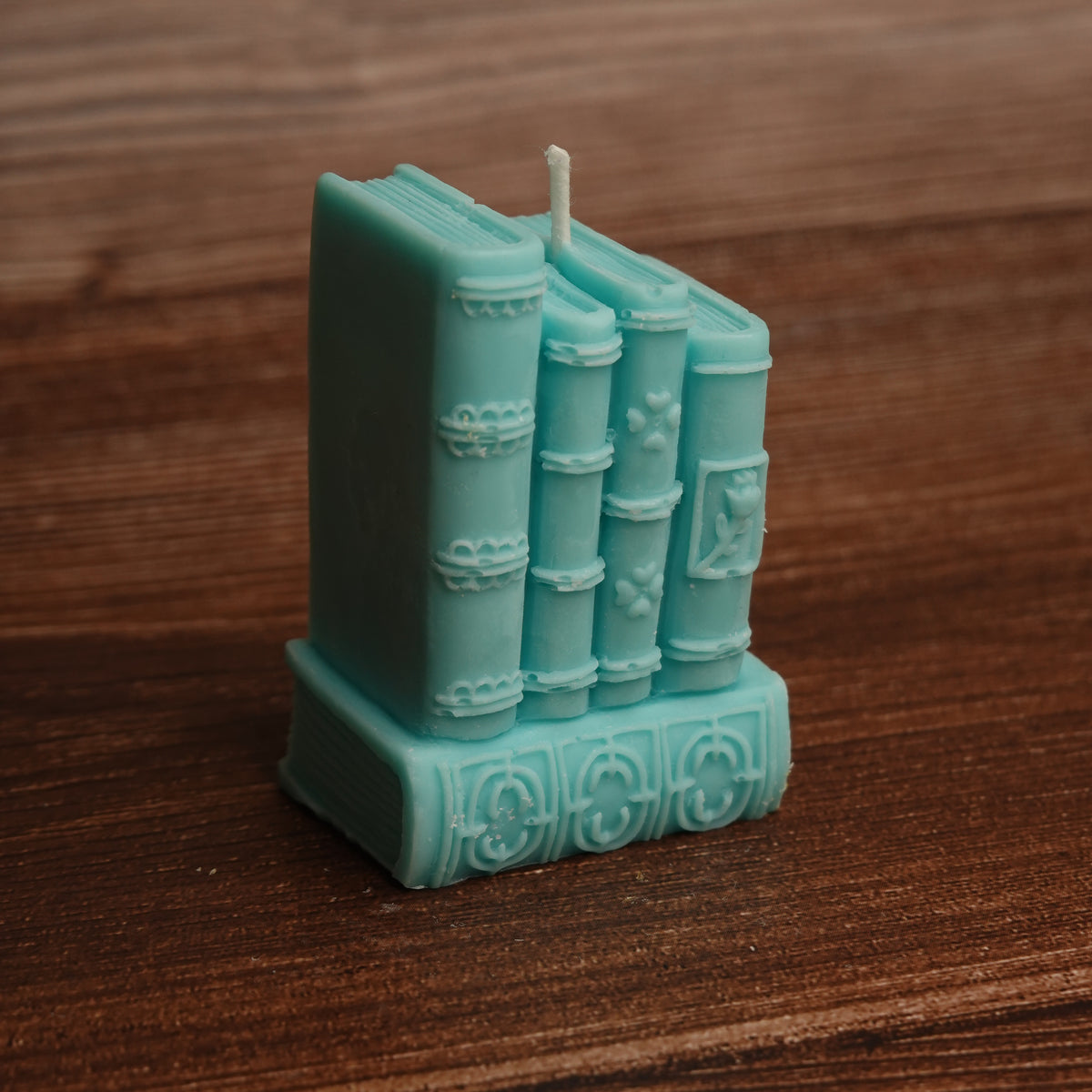 Book stack pillar candle turquoise purple