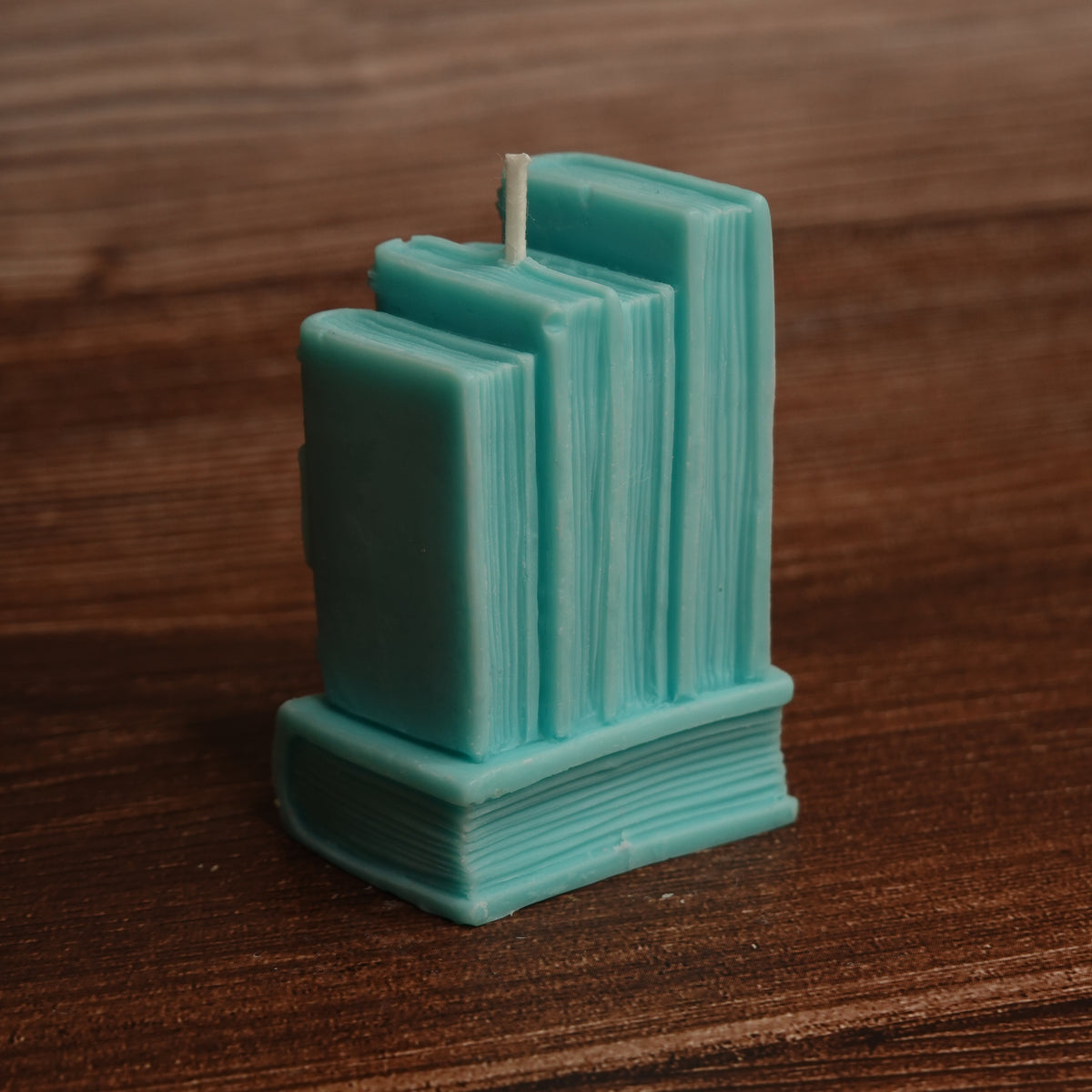 Book stack pillar candle turquoise purple