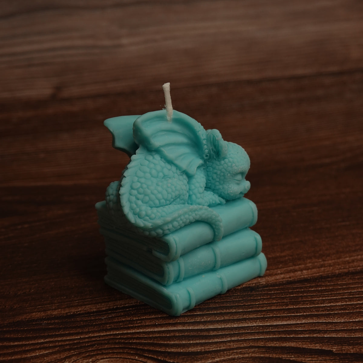 Dragon and books pillar candle turquoise